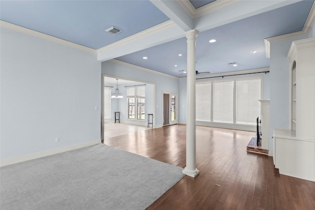 unfurnished living room featuring crown molding, ceiling fan, wood-type flooring, beamed ceiling, and ornate columns