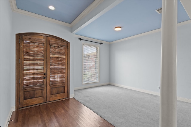 entryway featuring hardwood / wood-style floors and crown molding