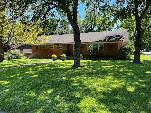 ranch-style house with a front lawn