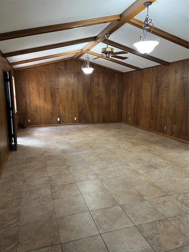 spare room with lofted ceiling with beams, tile patterned floors, ceiling fan, and wooden walls