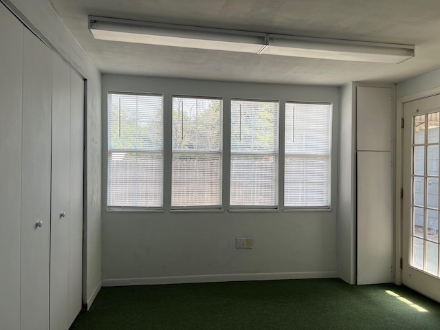 unfurnished sunroom featuring a wealth of natural light