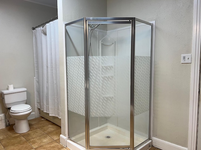 bathroom with curtained shower, tile patterned flooring, and toilet