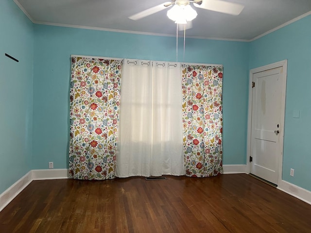 unfurnished room featuring ornamental molding, ceiling fan, and dark hardwood / wood-style floors