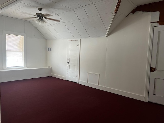 additional living space featuring carpet flooring, ceiling fan, and vaulted ceiling