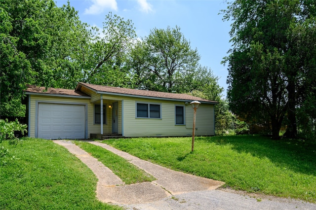 single story home featuring a garage and a front yard