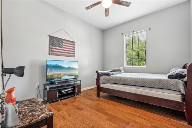 bedroom with ceiling fan and wood-type flooring