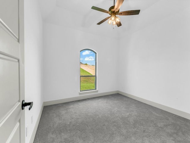 carpeted empty room featuring ceiling fan