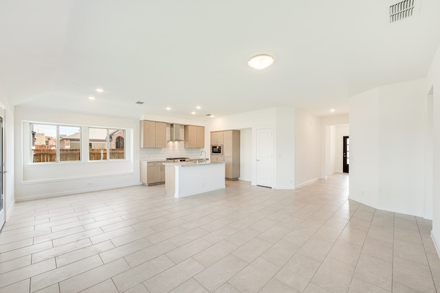 unfurnished living room featuring sink