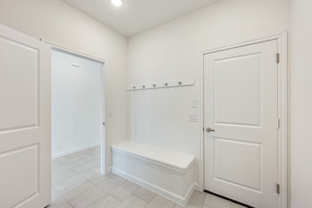 mudroom with light tile patterned floors