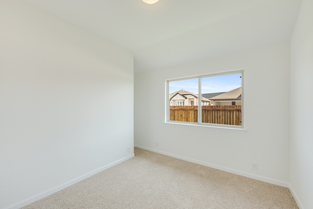 spare room featuring carpet floors