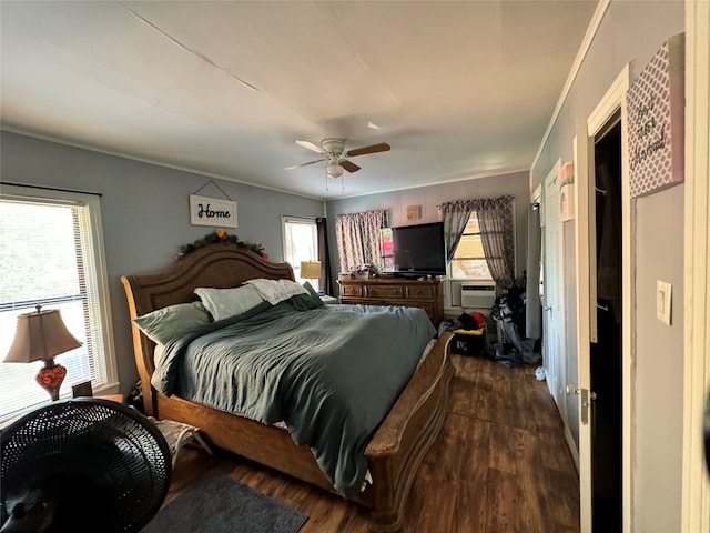 bedroom featuring ornamental molding, ceiling fan, and dark wood-type flooring