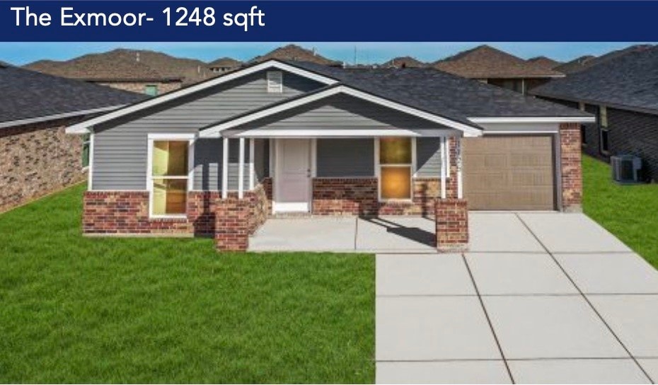 craftsman-style home featuring a garage, central AC, and a front lawn