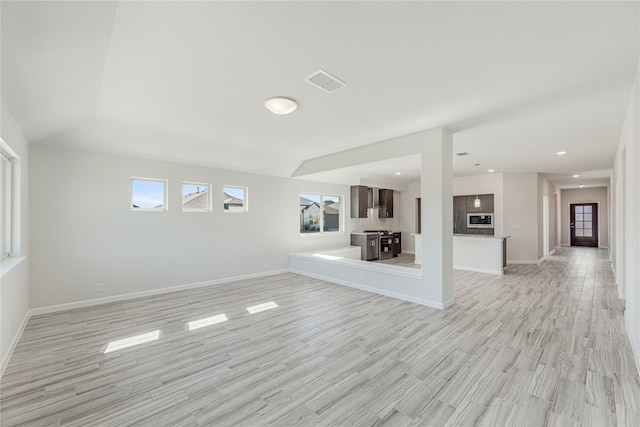 unfurnished living room featuring light wood-type flooring