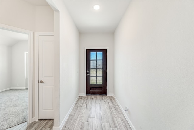 doorway to outside with light wood-type flooring