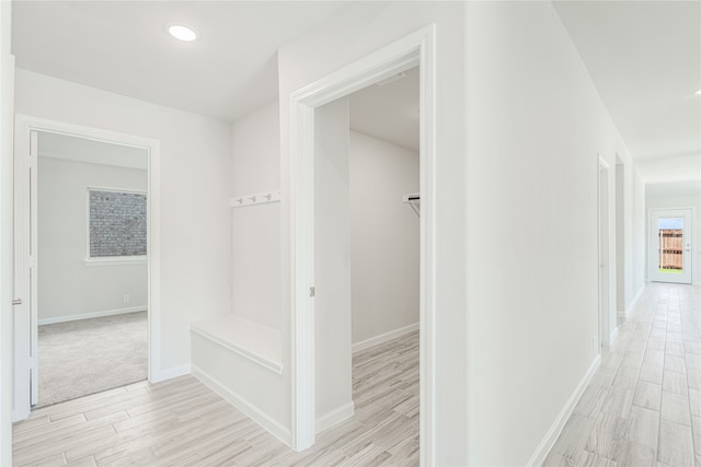 corridor featuring light hardwood / wood-style flooring