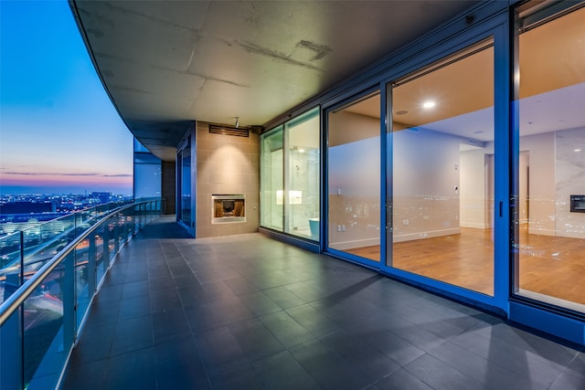 view of balcony at dusk