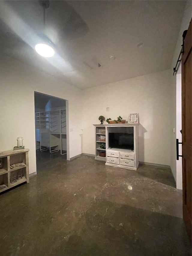 unfurnished living room with a barn door