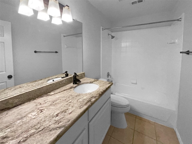 full bathroom with tiled shower / bath combo, vanity, tile patterned floors, and toilet