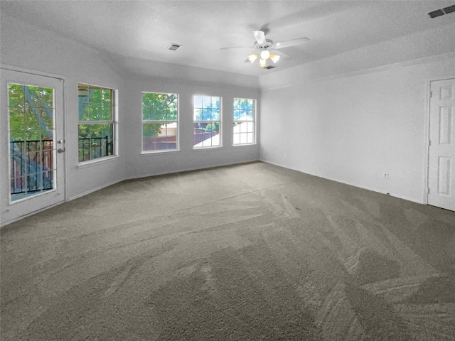 spare room with ceiling fan and carpet