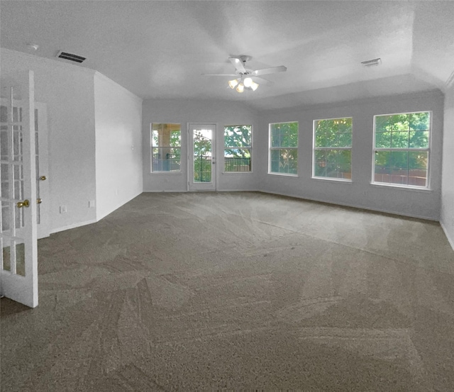 carpeted empty room with a textured ceiling and ceiling fan