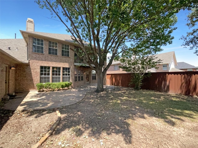 rear view of house featuring a patio