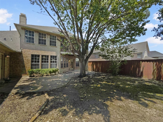 back of house featuring a patio area