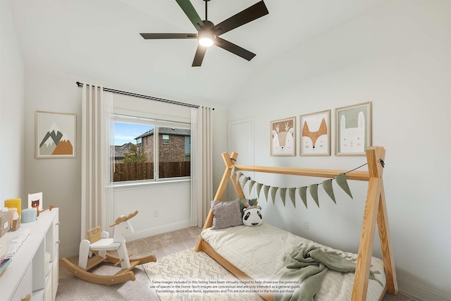 sitting room featuring ceiling fan, light colored carpet, and lofted ceiling