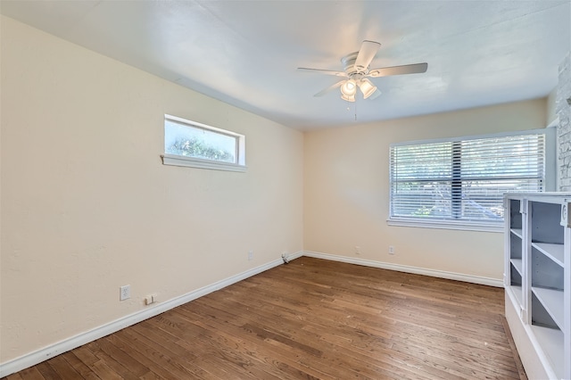 unfurnished room featuring hardwood / wood-style flooring and ceiling fan