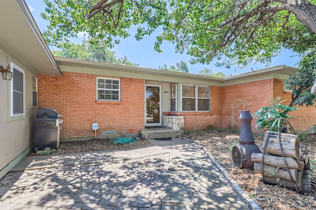 ranch-style home with a patio area