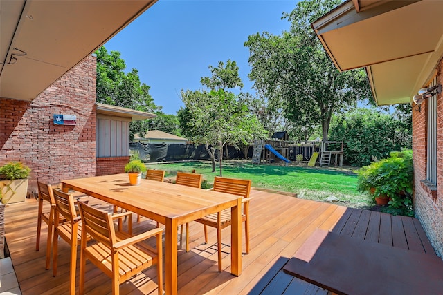 view of yard featuring a playground and a storage unit