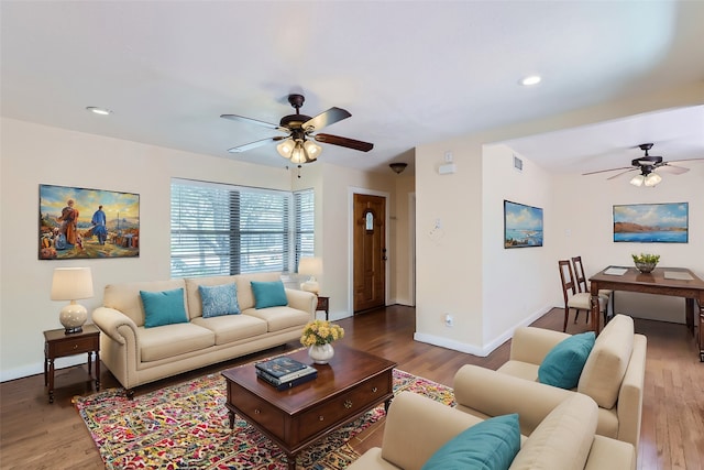 living room featuring hardwood / wood-style flooring and ceiling fan