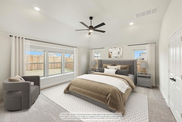 carpeted bedroom featuring vaulted ceiling and ceiling fan