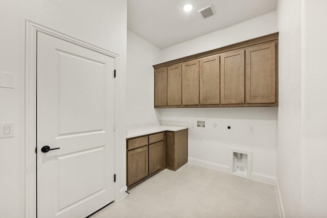 laundry area with cabinets, gas dryer hookup, electric dryer hookup, and washer hookup