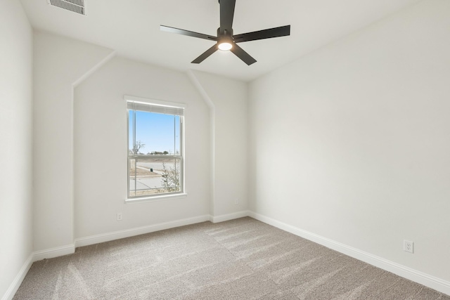 unfurnished room with ceiling fan, light colored carpet, and lofted ceiling