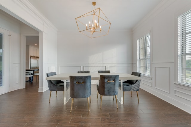 dining space featuring a notable chandelier, crown molding, and dark wood-type flooring