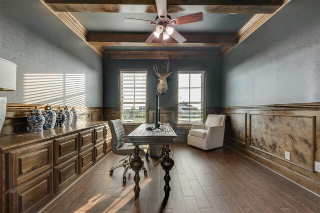 office featuring a textured wall, ceiling fan, beam ceiling, and dark wood-type flooring