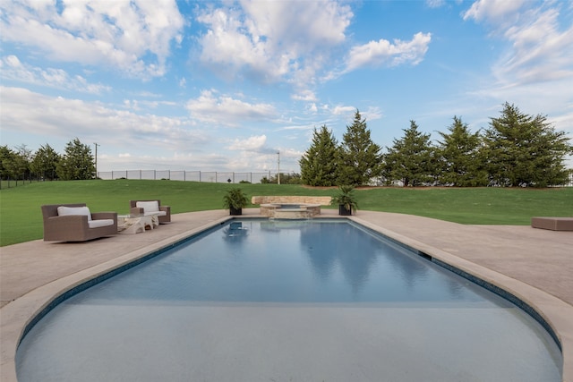 view of pool featuring a patio, a lawn, and an in ground hot tub