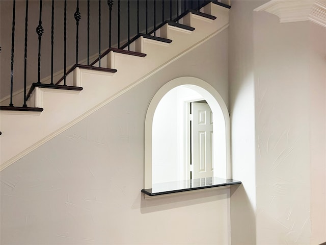 staircase with crown molding