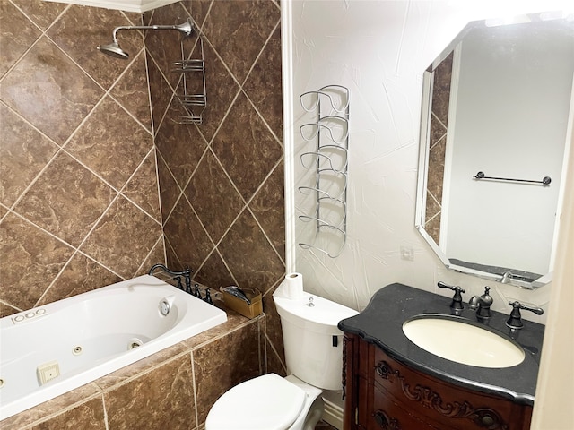 bathroom with tile walls, toilet, and vanity