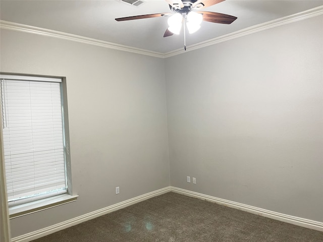 carpeted spare room featuring ornamental molding and ceiling fan