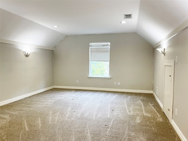 bonus room featuring carpet flooring and vaulted ceiling