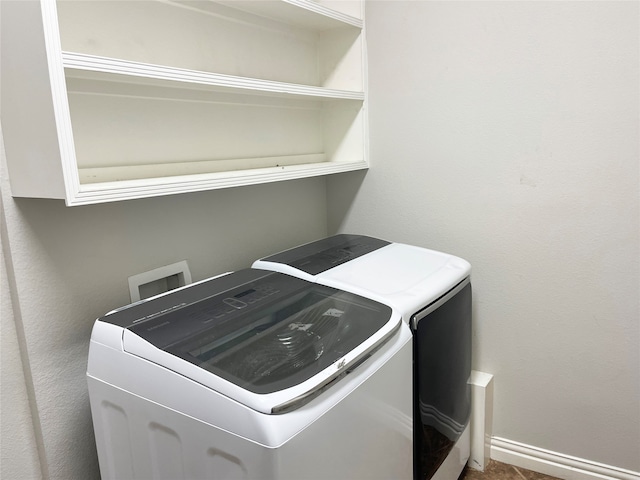 washroom with washer and dryer