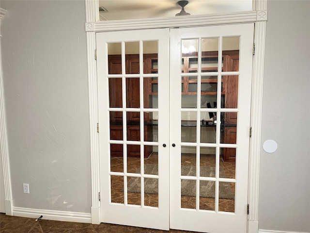 interior space featuring french doors and dark tile patterned floors