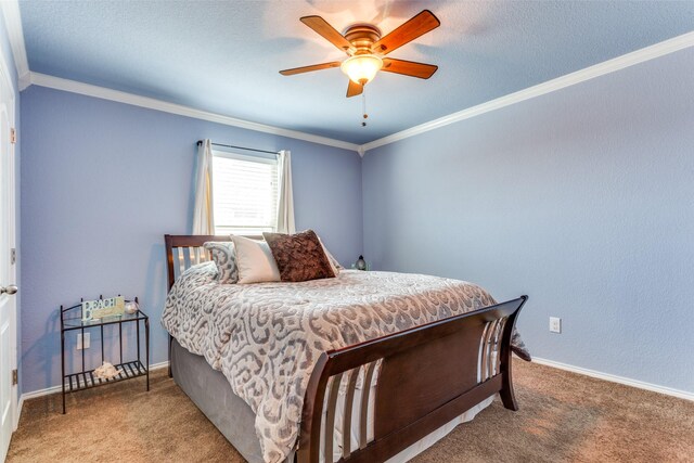 bedroom featuring ornamental molding, carpet flooring, and ceiling fan