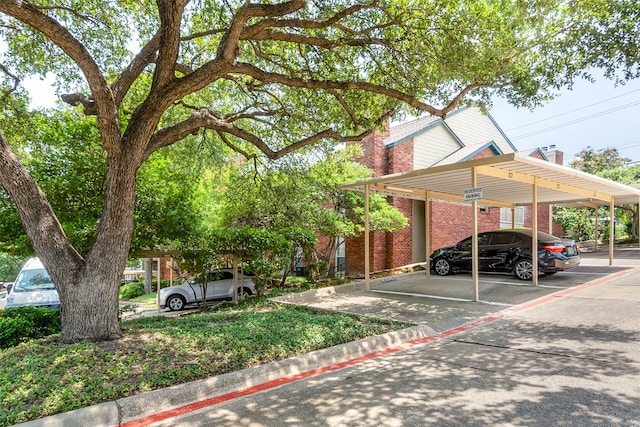 view of front of property featuring a carport