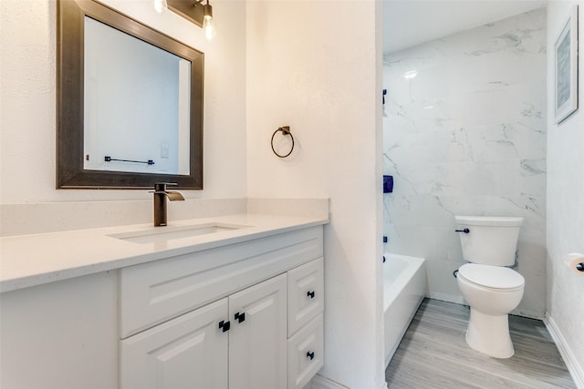 bathroom featuring vanity, hardwood / wood-style floors, and toilet