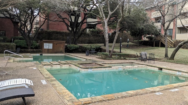 view of pool featuring a patio area