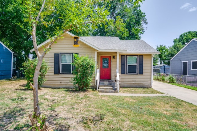 bungalow-style house with a front yard