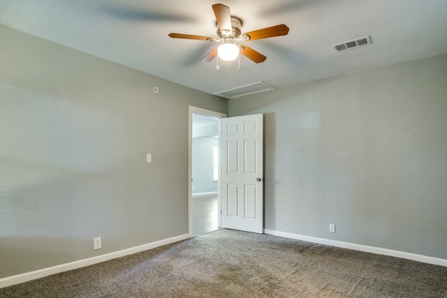 spare room with carpet floors and ceiling fan