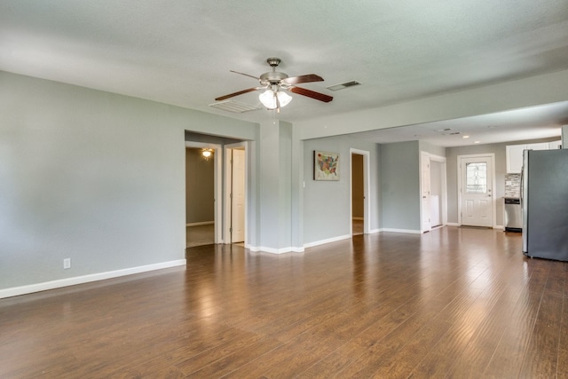 unfurnished room featuring ceiling fan and dark wood-type flooring